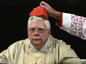 FILE - In this Thursday, Aug. 5, 2004 file photo, Cardinal Bernard Law has his skull cap adjusted during the ceremony for Our Lady of the Snows, in St. Mary Major's Basilica in Rome, Italy. An official with the Catholic Church says Cardinal Bernard Law, the disgraced former archbishop of Boston, has died at 86. Law recently had recently been hospitalized in Rome. Law stepped down under pressure in 2002 over his handling of clergy sex abuse cases.