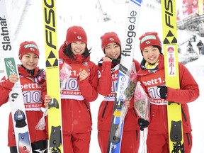 From left: Japan's ski jumping  team with  Sara Takanashi, Yuka Seto, Karoi Iwabuchi and Ito Yuki celebrate after winning the team event at the Ladies' ski jumping world Cup in Hinterzarten. Germany, Saturday, Dec. 16, 2017.