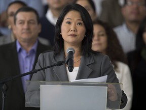 FILE - In this June 10, 2016 file photo, Keiko Fujimori concedes defeat in the presidential election in Lima, Peru. Prosecutors raided two offices of Peru's main opposition party on Thursday, Dec. 7, 2017 as part of an investigation of alleged money laundering by the campaign of losing presidential candidate Keiko Fujimori, daughter of imprisoned former strongman Alberto Fujimori, who governed Peru for a decade until 2000.