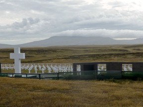 FILE - In this March 4, 2012 file photo, the tombs of some of the 649 Argentine soldiers killed in 1982 war, many unidentified, stand in a field at a cemetery near Darwin, Falkland Islands. In a statement released by the International Committee of the Red Cross on Friday, Dec. 1, 2017, a group of forensic experts have identified 88 of the Argentine soldiers buried at the cemetery. (AP Photo/Michael Warren, File)