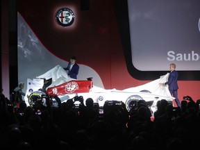 Drivers Marcus Ericsson, of Sweden, right, and Charles Leclerc, of Monaco, unveil the Alfa Romeo Sauber F1 Team on the occasion of its official presentation in Arese, Italy, Saturday, Dec. 2, 2017. The Alfa Romeo Sauber F1 Team will compete in the 2018 Formula 1 World Championship.