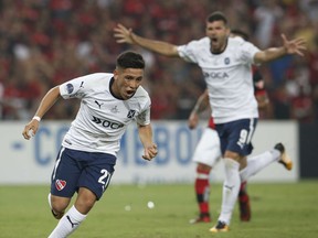 Argentina's Independiente Ezequiel Barco celebrates his penalty goal against Brazil's Flamengo during the Copa Sudamericana final championship soccer match at Maracana stadium in Rio de Janeiro, Brazil, Wednesday, Dec.13, 2017. Behind is Emmanuel Gigliotti.