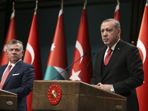 Turkey's President Recep Tayyip Erdogan, right, talks during a joint news conference with Jordan's King Abdullah II, left, following their meeting at the Presidential Palace in Ankara, Turkey, Wednesday, Dec. 6, 2017. Erdogan has warned that the recognition of Jerusalem as Israel's capital will lead to "public unrest" in the Islamic world. Without directly naming U.S. President Donald Trump, Erdogan said: "No one has the right to play with the fate of billions of people for the sake of personal whims."