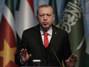 Turkey's President Recep Tayyip Erdogan gestures as he talks during the closing news conference following the Organisation of Islamic Cooperation's Extraordinary Summit in Istanbul, Wednesday, Dec. 13, 2017. Muslim nations of the 57-member Organisation of Islamic Cooperation are rejecting U.S. President Donald Trump's declaration of Jerusalem as the capital of Israel, and appear set to counter it with a declaration of east Jerusalem as the capital of a future Palestinian state.