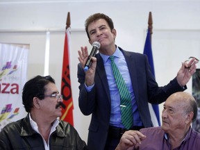 Opposition Alliance presidential candidate Salvador Nasralla, center, speaks during a press conference accompanied by ousted Honduran President Manuel Zelaya, left, and union leader Carlos Reyes in Tegucigalpa, Honduras, Thursday, Dec. 7, 2017. Latin American governments on Wednesday applauded Honduras' willingness to recount disputed votes from the Nov. 26 presidential elections, but questions remain about how thorough that recount will be.