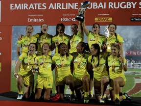 Australia's players celebrate 0-34 victory over the United States in the final of the World Rugby Women's Sevens Series in Dubai, the United Arab Emirates, Friday, Dec. 1, 2017