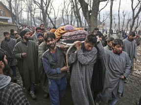 Kashmiri villagers carry the body of Ruby Jan during her funeral at Shopian 55 kilometers (34 miles) south of Srinagar, Indian controlled Kashmir Tuesday, Dec. 19, 2017. Police say a woman was killed during anti-India protests in disputed Kashmir following a gun battle that killed two rebels. Fighting erupted after Indian troops cordoned off a village in the southern Shopian area overnight on a tip that militants were hiding in a house.