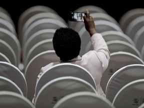 A delegate takes a selfie before the closing ceremony of the Ministerial Conference of the World Trade Organization in Buenos Aires, Argentina, Wednesday, Dec. 13, 2017.