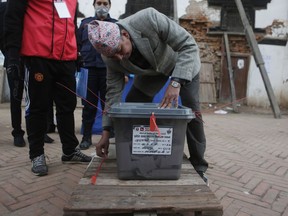 Nepalese election officials seal the ballot box after voting ended at a polling station in Kathmandu, Nepal, Thursday, Dec. 7, 2017. Millions of people in southern Nepal voted Thursday in the final phase of mostly peaceful elections for members of the national and provincial assemblies.