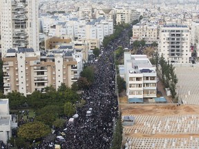 Thousand gather at the funeral Rabbi Aharon Leib Shteinman in the central Israeli city of Bnei Brak, Tuesday, Dec. 12, 2017. Shteinman , the spiritual leader of Israel's non-Hassidic ultra-Orthodox Jews of European descent and one of the country's most influential and powerful rabbis, died on Tuesday. He was 104.