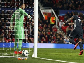 Manchester United's goalkeeper Sergio Romero, left, appeals to the officials for offside as CSKA's Vitinho celebrate after his team scored a goal during the Champions League group A soccer match between Manchester United and CSKA Moscow in Manchester, England, Tuesday, Dec. 5, 2017.