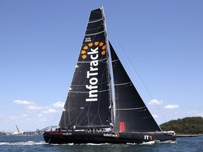 In this Dec. 12, 2017, photo, the maxi yacht InfoTrack maneuvers before the start of the Big Boat Challenge, a lead-up event to the Sydney Hobart open ocean yacht race, on Sydney Harbour in Sydney. InfoTrack won the 630-nautical-mile Sydney Hobart race last year, setting the race record of 1 day, 13 hours, 31 minutes and 20 seconds. The 73rd edition of the race from Sydney Harbor to the island state of Tasmania begins on Dec. 26 and has 103 entries, including 30 international boats.