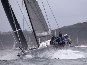 The supermaxi Black Jack passes the heads of Sydney Harbour during the start of the Sydney Hobart yacht race in Sydney, Tuesday, Dec. 26, 2017. The 630-nautical mile race has102 yachts starting in the race to the island state of Tasmania.