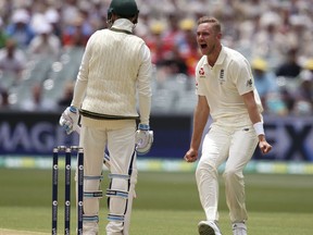 England's Stuart Broad, right, celebrates trapping Australia's Peter Handscomb LBW for 36 runs during the second day of their Ashes test match in Adelaide, Sunday, Dec. 3, 2017.