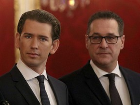 Foreign Minister and leader of the Austrian People's Party, OEVP, Sebastian Kurz, left,  and Heinz-Christian Strache, chairman of the right-wing Freedom Party, FPOE, listen after talks wiih Austrian President Alexander van der Bellen for forming a new coalition government at the Hofburg palace in Vienna, Austria, Saturday, Dec. 16, 2017.