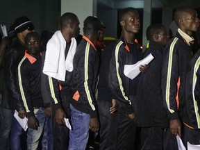 Nigerian returnees from Libya wait to be registered by officials upon arrival at the Murtala Muhammed International Airport in Lagos Nigeria Tuesday, Dec. 5, 2017. Hundreds of Nigerians have returned from Libya, Tuesday, as part of an organized repatriation by The African Union and member states amid outrage over recent footage that showed migrants being auctioned off as slaves.