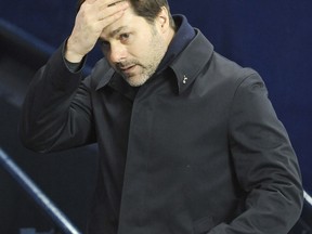 Tottenham's manager Mauricio Pochettino awaits the start of the English Premier League soccer match between Manchester City and Tottenham Hotspur at Etihad stadium, in Manchester, England, Saturday, Dec. 16, 2017.