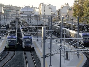 Trains sit at the central railway station during a 24-hour strike in Athens, Thursday, Dec. 14, 2017. Greece's largest labor unions call for a general strike over planned austerity cuts in 2018-19 as unemployment remains over 20 percent and poverty levels have surged over the past few years since the country first required an international financial rescue in 2010.