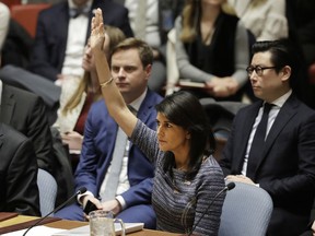 U.S. Ambassador Nikki Haley votes in favor of a resolution, Friday, Dec. 22, 2017, at United Nations headquarters. The Security Council is voting on proposed new sanctions against North Korea, including sharply lower limits on its refined oil imports, the return home of all North Koreans working overseas within 12 months, and a crackdown on the country's shipping.