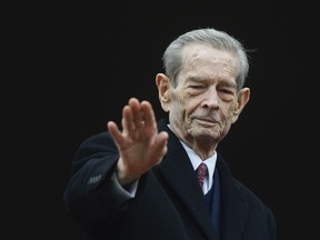 FILE - In this Wednesday, Nov. 19, 2014 file picture, Romania's former King Michael waves to supporters during an appearance at the Elisabeta Palace in Bucharest, Romania.  Romania's royal house says former King Michael, who ruled Romania during WWII, has died,  Tuesday, Dec. 5, 2017, in Switzerland aged 96.