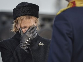 Princess Margaret of Hohenzollern, daughter of former Romanian King Michael I, cries next to his coffin, at Bucharest's Henri Coanda airport, outside Bucharest, Romania, Wednesday, Dec. 13, 2017. Former King Michael, who ruled Romania during WWII, has died on Dec. 5, aged 96, in Switzerland and will be buried this weekend.