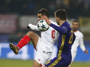 Sevilla's Wissam Ben Yedder fights for the ball with Maribor's Mitja Viler during the group E Champions League soccer match between Maribor and Sevilla at the Ljudski Vrt stadium in Maribor, Slovenia, Wednesday, Dec. 6, 2017.