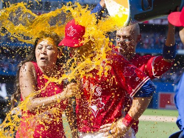 Sportsnet broadcaster Hazel Mae and Toronto Blue Jays outfielder Steve Pearce are doused with Gatorade on July 30.