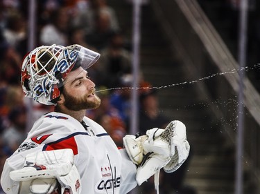 Washington Capitals goalie Braden Holtby spits water during a break in play agains the Edmonton Oilers on Oct. 28.