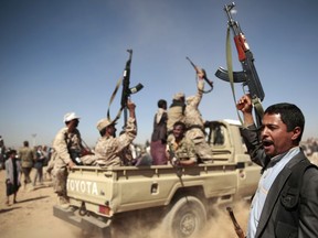 Tribesmen loyal to Houthi rebels chant slogans during a gathering on Jan. 3, 2017, in Sanaa, Yemen. Houthi rebels are persecuting members of the Baha’i faith in Yemen.