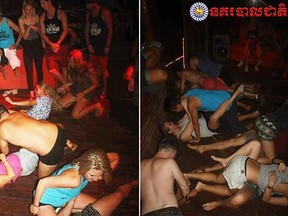 In this photo dated Jan. 25, 2018, issued by Cambodian National Police, a group of unidentified foreigners, who are accused of "dancing pornographically" at a party in Siem Reap town, near the country's famed Angkor Wat temple complex.