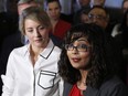 Liberal MP Iqra Khalid makes an announcement about M-103 on Parliament Hill while Minister of Canadian Heritage Melanie Joly looks on, on Feb. 15, 2017.