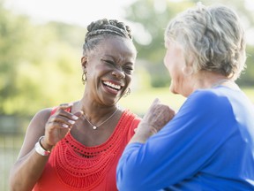 Senior multi-racial women, best friends,  laughing