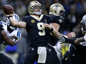 Drew Brees of the New Orleans Saints throws the ball during the first half of the NFC Wild Card playoff game against the Carolina Panthers at the Mercedes-Benz Superdome on Sunday in New Orleans, Louisiana.