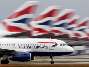 A British Airways plane lands at Heathrow Airport on March 19, 2010 in London, England.