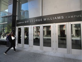 A student walks by Henry F. Hall building at the Sir George Williams campus of Concordia University in Montreal.