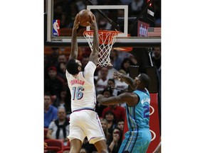 Miami Heat forward James Johnson (16) dunks against Charlotte Hornets forward Marvin Williams (2) during the first half of an NBA basketball game, Saturday, Jan. 27, 2018, in Miami.