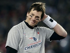 New England Patriots quarterback Tom Brady smiles after winning the AFC championship NFL football game 24-20 over the Jacksonville Jaguars, Sunday, Jan. 21, 2018, in Foxborough, Mass.