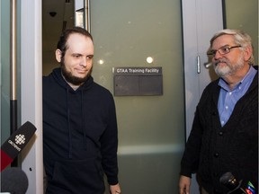 This file photo shows Joshua Boyle and his father at the airport in Toronto on Friday, October 13, 2017.