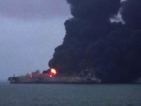 This frame grab taken from Chinese state broadcaster CCTV on January 8, 2018 shows smoke and flames coming from a burning oil tanker at sea off the coast of eastern China.