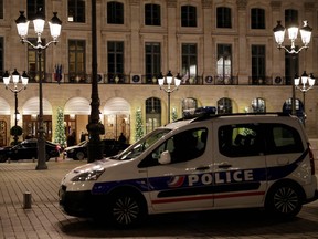 A picture shows a police car parked outside the Ritz luxury hotel in Paris on January 10, 2018, after an armed robbery.