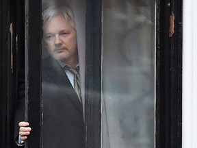 This file photo taken on February 05, 2016 shows WikiLeaks founder Julian Assange coming out onto the balcony of the Ecuadorian embassy to address the media in central London on February 5, 2016.