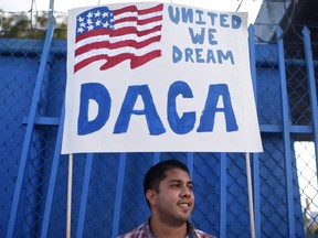 This file photo taken on September 10, 2017 shows DACA recipient and appliance repair business owner Erick Marquez during a protest in support of DACA (Deferred Action for Childhood Arrivals) in Los Angeles, California.