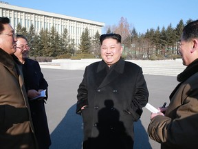 Kim Jong-Un, centre, inspecting the State Academy of Sciences at an undisclosed location.