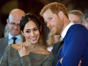 Britain's Prince Harry and his fiancée, U.S. actress Meghan Markle, watch a dance performance by Jukebox Collective during a visit at Cardiff Castle in Cardiff, south Wales on January 18, 2018, for a day showcasing the rich culture and heritage of Wales.