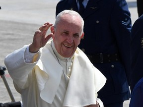 Pope Francis gets ready to board the plane to leave the northern Chilean city of Iquique, heading to Lima, Peru on January 18, 2018.