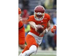 North Squad quarterback Baker Mayfield, of Oklahoma, hands off the ball during the first half of the Senior Bowl college football game in Mobile, Ala.,Saturday, Jan. 27, 2018.