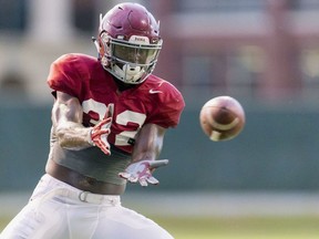 FILE - In this Aug. 9, 2017, file photo, Alabama linebacker Rashaan Evans (32) works through drills during football practice at the Thomas-Drew Practice Fields in Tuscaloosa, Ala. Evans doesn't downplay how disruptive injuries have been to the Crimson Tide linebacker corps. He says the injuries have affected chemistry and schemes.