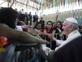 Pope Francis greets inmates at the San Joaquin women's prison in Santiago, Chile, Tuesday, Jan. 16, 2018.