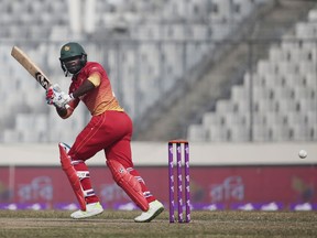 Zimbabwe's Solomon Mire plays a shot during the Tri-Nation one-day international cricket series against Sri Lanka in Dhaka, Bangladesh, Sunday, Jan. 21, 2018.