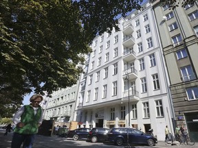 FILE - In this Monday, Sept. 19, 2016 file photo, shows an apartment building freshly renovated by an international developer group that bought the house from the husband of Warsaw Mayor Hanna Gronkiewicz-Waltz, in Warsaw, Poland. Warsaw town hall says the city mayor's husband has returned money obtained from property restitution that was found to be unlawful, a case that had burdened Poland's main centrist opposition party.